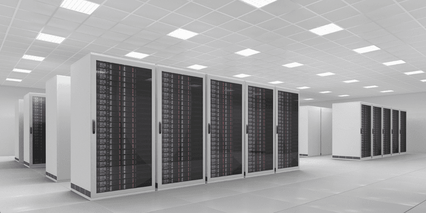 Modern data center with rows of black server racks and bright overhead lighting